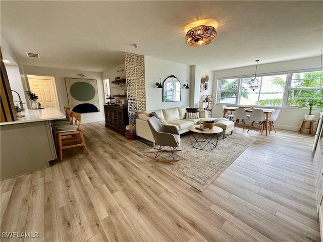 living room with light hardwood / wood-style floors