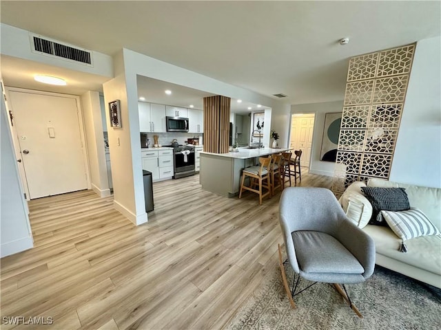 living room featuring light wood-type flooring