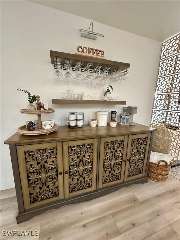 bar featuring light wood-type flooring