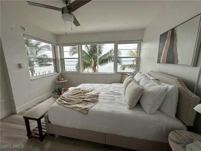 1900 Clifford St Unit 201, Fort Myers, FL 33901 - bedroom with wood finished floors, baseboards, and a ceiling fan