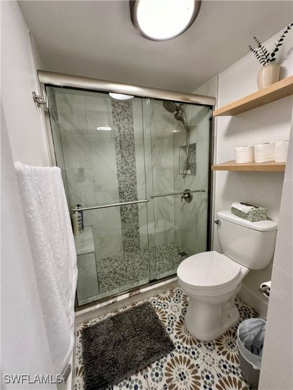 bathroom with tile patterned floors, toilet, and walk in shower