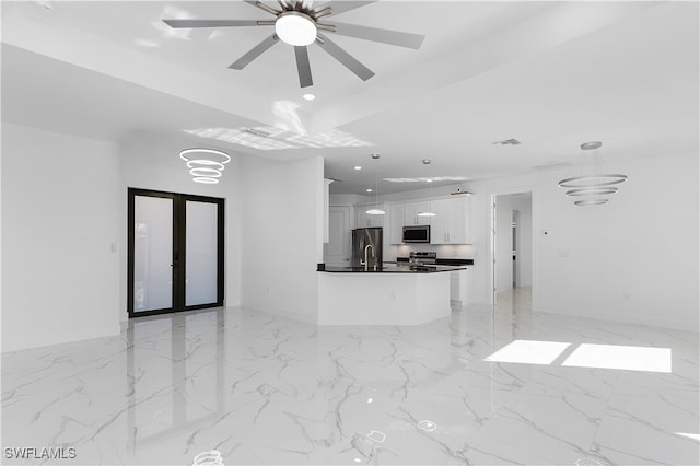 living room featuring ceiling fan, sink, and french doors