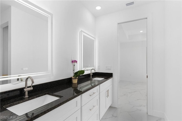 2517 11th St SW, Lehigh Acres, FL 33976 - bathroom featuring marble finish flooring, double vanity, and recessed lighting