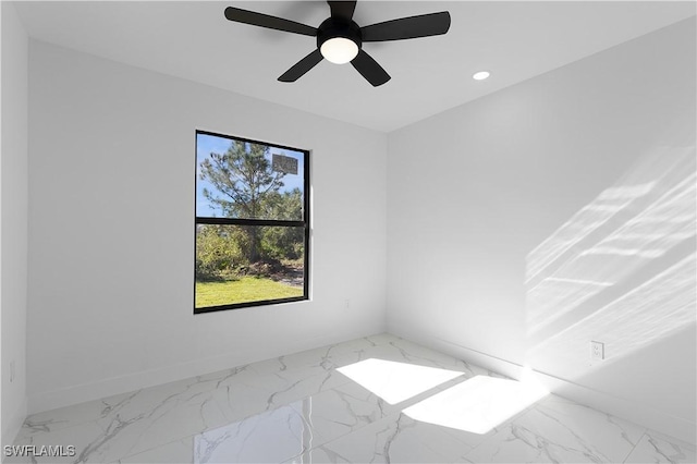 2517 11th St SW, Lehigh Acres, FL 33976 - unfurnished room featuring marble finish flooring, recessed lighting, and baseboards