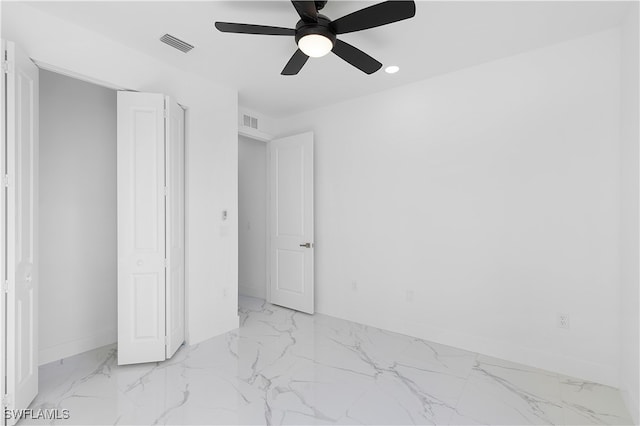 unfurnished bedroom featuring ceiling fan