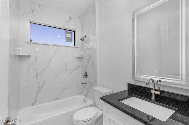 full bathroom featuring vanity, toilet, and tiled shower / bath