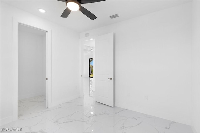 2517 11th St SW, Lehigh Acres, FL 33976 - unfurnished bedroom with light marble finish flooring, baseboards, recessed lighting, and a ceiling fan