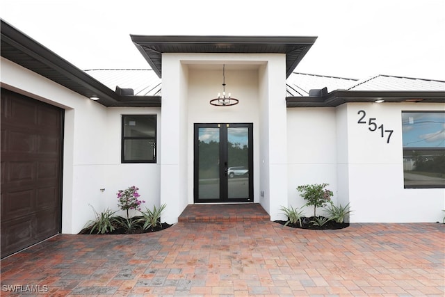 property entrance with french doors and a garage