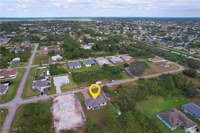 2517 11th St SW, Lehigh Acres, FL 33976 - aerial view of property and surrounding area with nearby suburban area