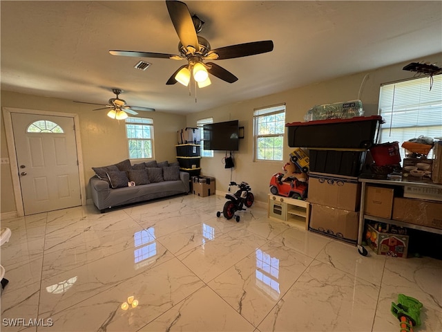 living room featuring ceiling fan