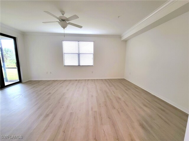 unfurnished room with ornamental molding, light hardwood / wood-style flooring, and a healthy amount of sunlight