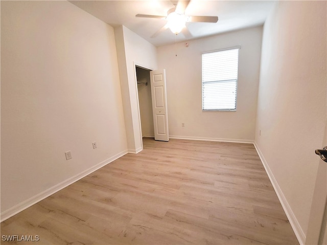 unfurnished bedroom with ceiling fan and light hardwood / wood-style flooring