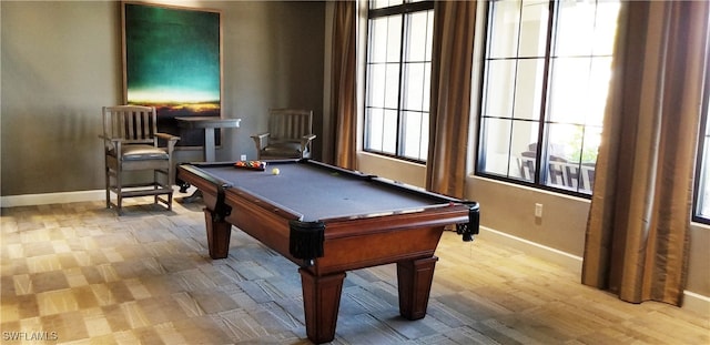 rec room with a healthy amount of sunlight, light wood-type flooring, and pool table