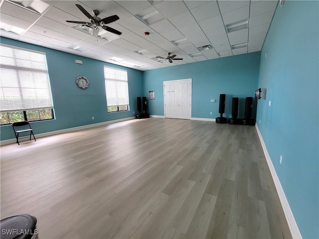 empty room with light hardwood / wood-style flooring and a drop ceiling