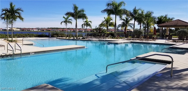 view of swimming pool with a patio area