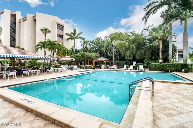 view of swimming pool featuring a gazebo and a patio