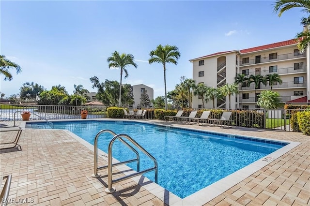 view of swimming pool featuring a patio area