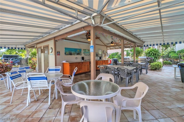 view of patio featuring ceiling fan