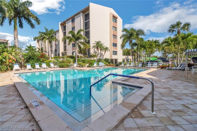 4140 Steamboat Bnd E Unit 502, Fort Myers, FL 33919 - community pool featuring a patio area