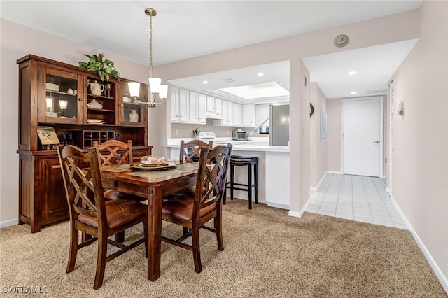 4140 Steamboat Bnd E Unit 502, Fort Myers, FL 33919 - dining area featuring a chandelier, light colored carpet, baseboards, recessed lighting, and light tile patterned floors