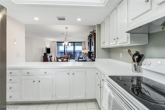 4140 Steamboat Bnd E Unit 502, Fort Myers, FL 33919 - kitchen with white electric range oven, range hood, white cabinetry, recessed lighting, and light countertops