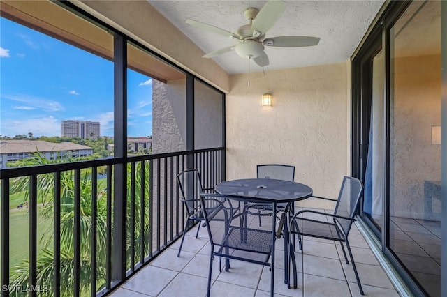 4140 Steamboat Bnd E Unit 502, Fort Myers, FL 33919 - balcony featuring a ceiling fan and outdoor dining space