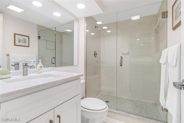 4140 Steamboat Bnd E Unit 502, Fort Myers, FL 33919 - full bathroom with a shower stall, vanity, toilet, and recessed lighting