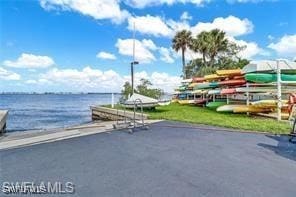 4140 Steamboat Bnd E Unit 502, Fort Myers, FL 33919 - view of patio with a water view