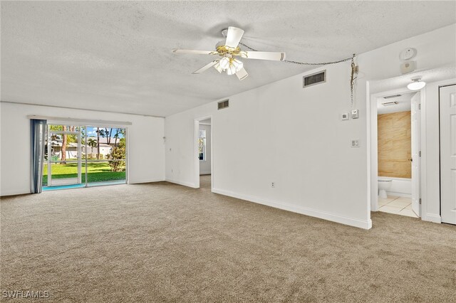 7068 Nantucket Cir Unit 3, North Fort Myers, FL 33917 - spare room featuring carpet floors, a textured ceiling, and a ceiling fan