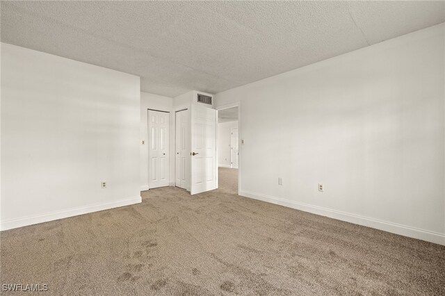7068 Nantucket Cir Unit 3, North Fort Myers, FL 33917 - carpeted spare room featuring baseboards and a textured ceiling