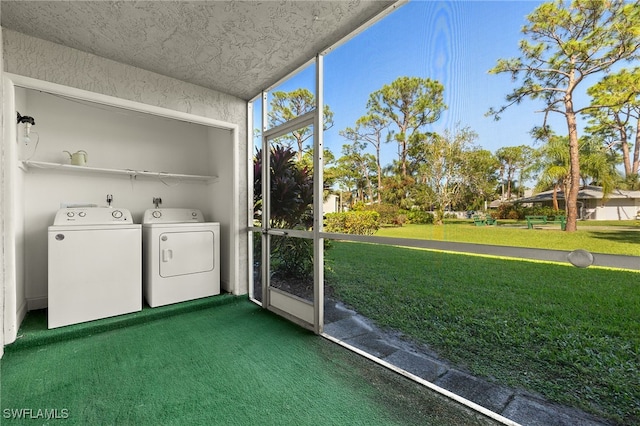 laundry area featuring washer and dryer and dark colored carpet