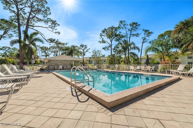 view of swimming pool with a patio area