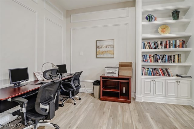 office space with light hardwood / wood-style flooring