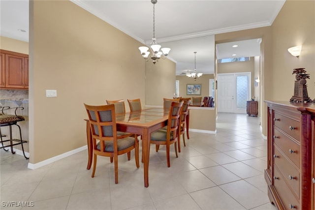 dining space featuring ornamental molding, a notable chandelier, and light tile patterned flooring