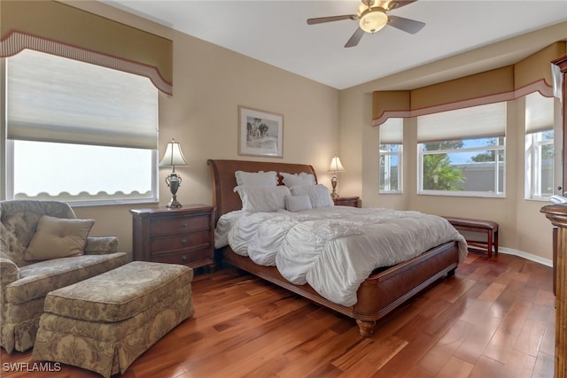 bedroom with wood-type flooring and ceiling fan