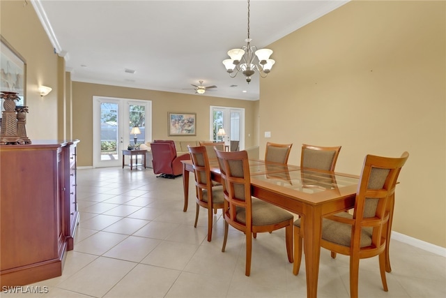 dining room featuring crown molding, french doors, light tile patterned floors, and ceiling fan with notable chandelier