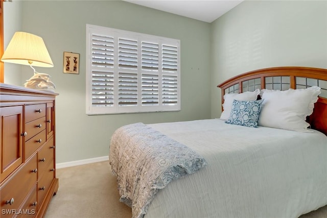 bedroom with light colored carpet