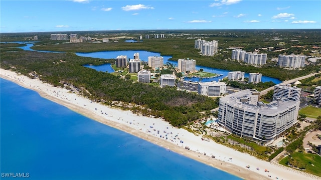 bird's eye view featuring a view of the beach and a water view