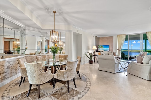 dining room featuring crown molding and a notable chandelier