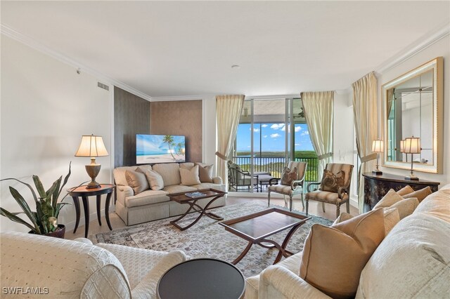 285 Grande Way Unit 705, Naples, FL 34110 - living area featuring wood finished floors and crown molding
