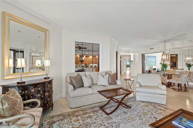 living room featuring ornamental molding and a chandelier