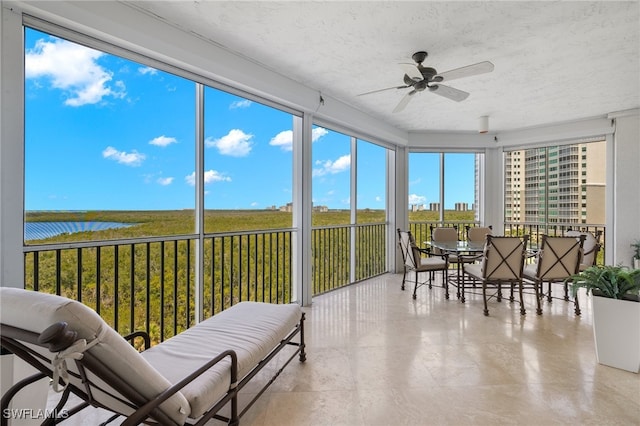 285 Grande Way Unit 705, Naples, FL 34110 - sunroom with a ceiling fan, outdoor dining space, and a textured ceiling