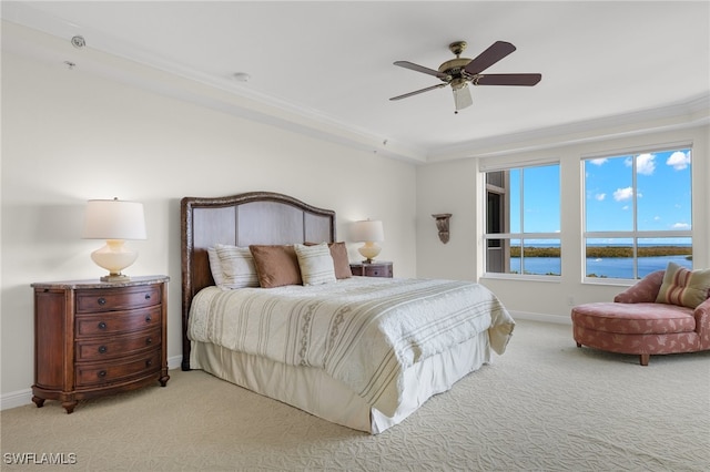 285 Grande Way Unit 705, Naples, FL 34110 - carpeted bedroom featuring ceiling fan, a water view, and ornamental molding