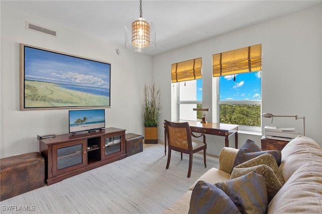 living room featuring a notable chandelier