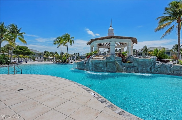 view of pool with a gazebo and pool water feature