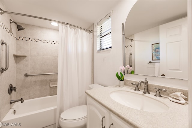 full bathroom featuring vanity, shower / bath combination with curtain, and toilet