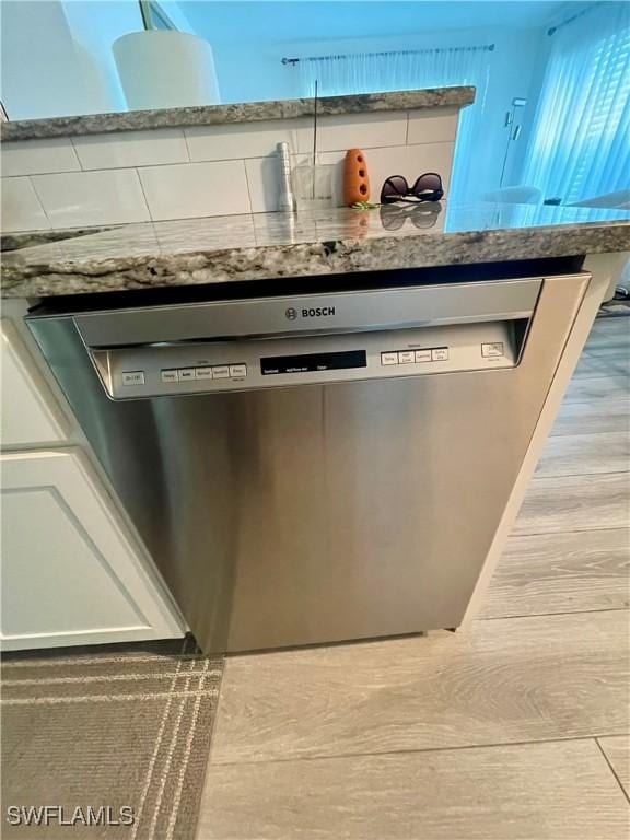 details featuring dishwasher and white cabinets