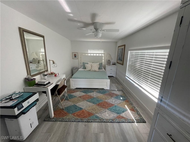 bedroom featuring ceiling fan and hardwood / wood-style flooring