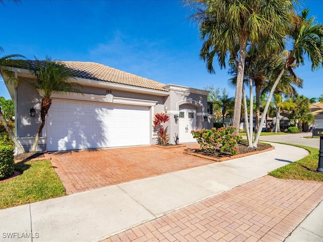 mediterranean / spanish-style home featuring a garage