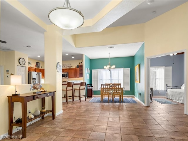 dining space featuring an inviting chandelier